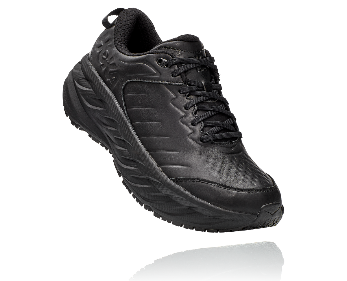 A black cushioned running shoe photographed at an angle on a plain background